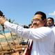 A President Media Davison handout picture shows Sri Lankan President preparing to fire a flare while special representative from China, Sang Guowei watches from behind welcoming the first ship, Sri Lanka Navy vessel Jetliner into the newly built Magampura Mahinda Rajapaksa Port which was ceremonial commissioned in Hambantota 238kms south of Colombo 18 November 2010. The first stage of the Hambantota or Magampura Mahinda Rajapaksa Port in Hambantota, build with Chinese assistance was commissioned today amidst much grandeur. Today also marks President Percy Mahendra ?Mahinda? Rajapaksa?s 65th birthday. He is to take oaths for a second term as president of the island nation tomorrow (Nov. 19) and several events are being held in commemoration.